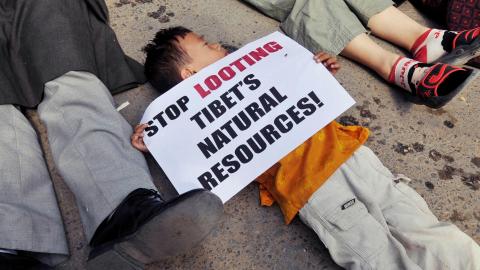 Young Tibetan boy protesting against China's looting of Tibet's natural resources